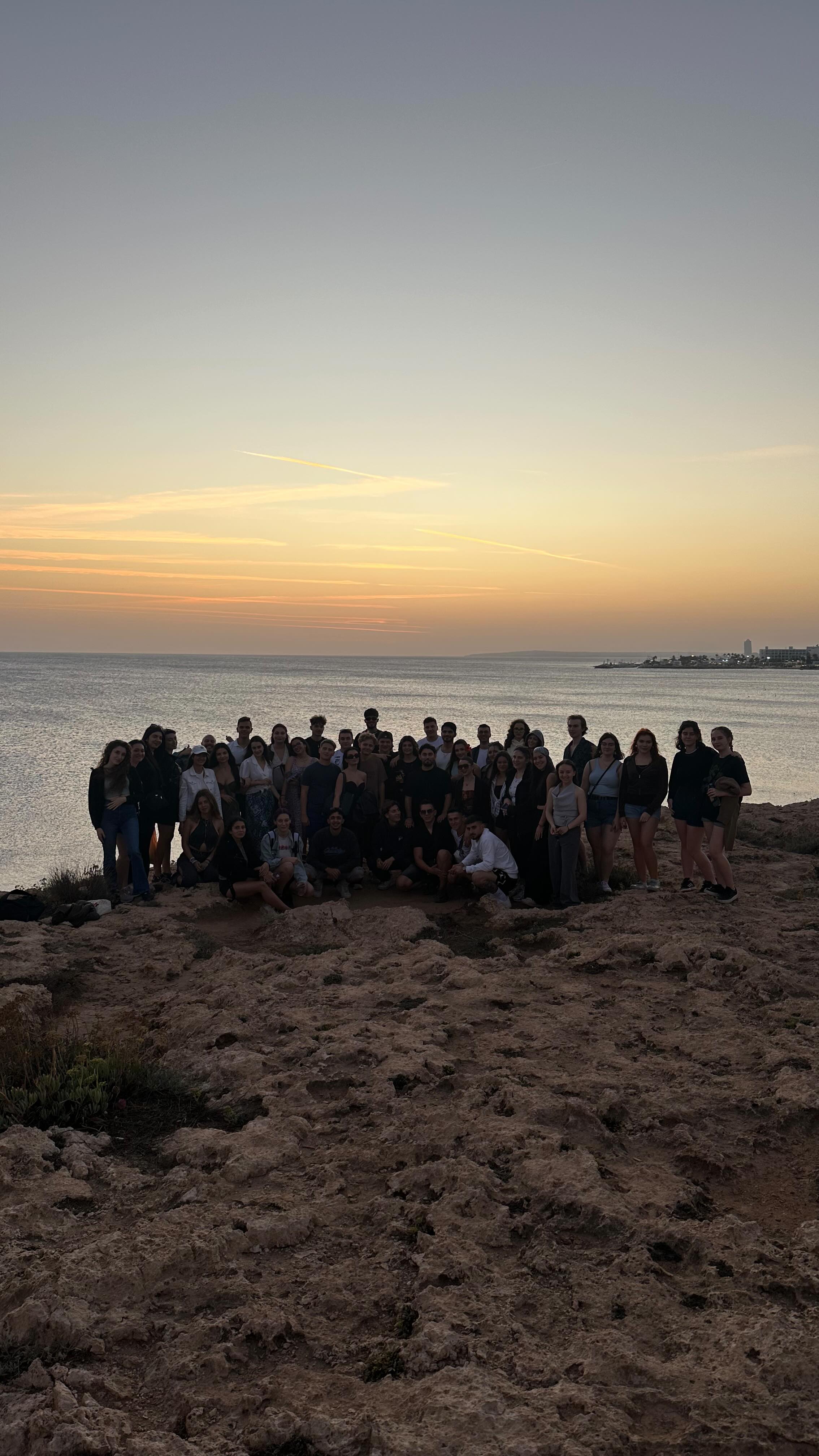 Erasmus+ participants together at sunset