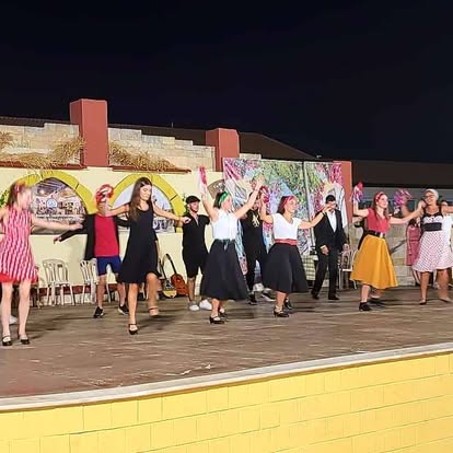 Traditional dance performance on an outdoor stage
