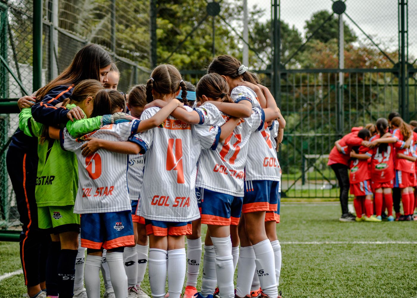 Youth sport team huddle representing fair play and inclusion