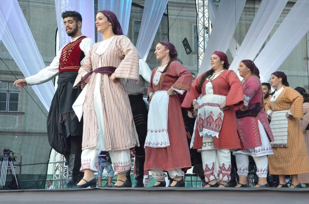 Dance department performing traditional dance on stage